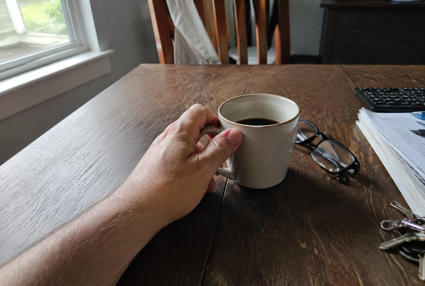 A cup of afternoon coffee on an ordinary kitchen table